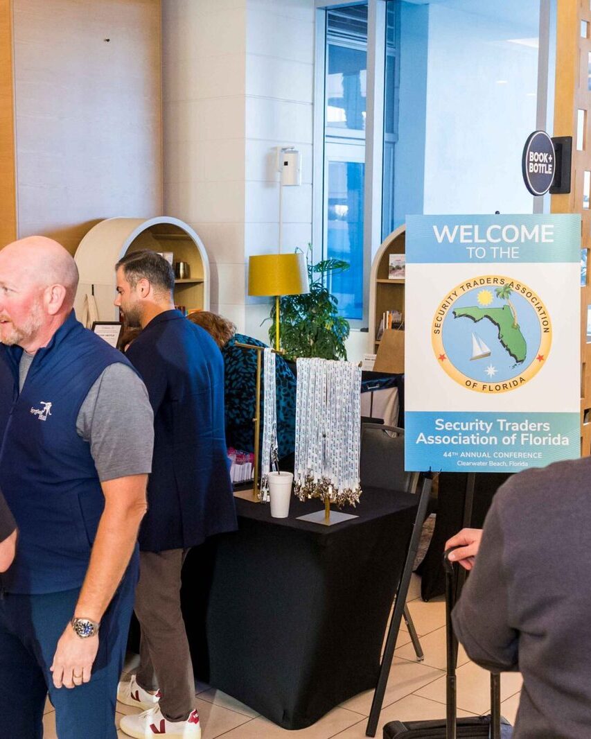 Members networking at the STA Florida conference welcome table